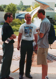 IPF students talking near campus fountain.