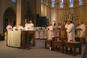 Priest blessing the Communion elements.