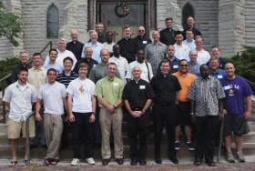 IPF Students pose for a photo on the stairs of St. John&rsquo;s Church.